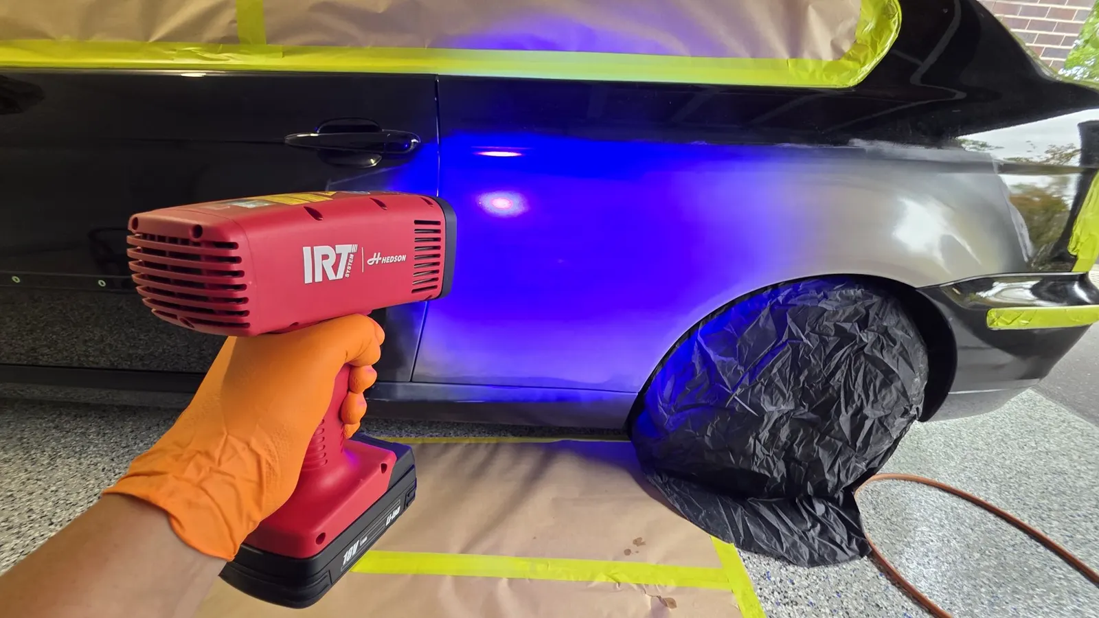 IRT curing equipment being used on a masked car panel